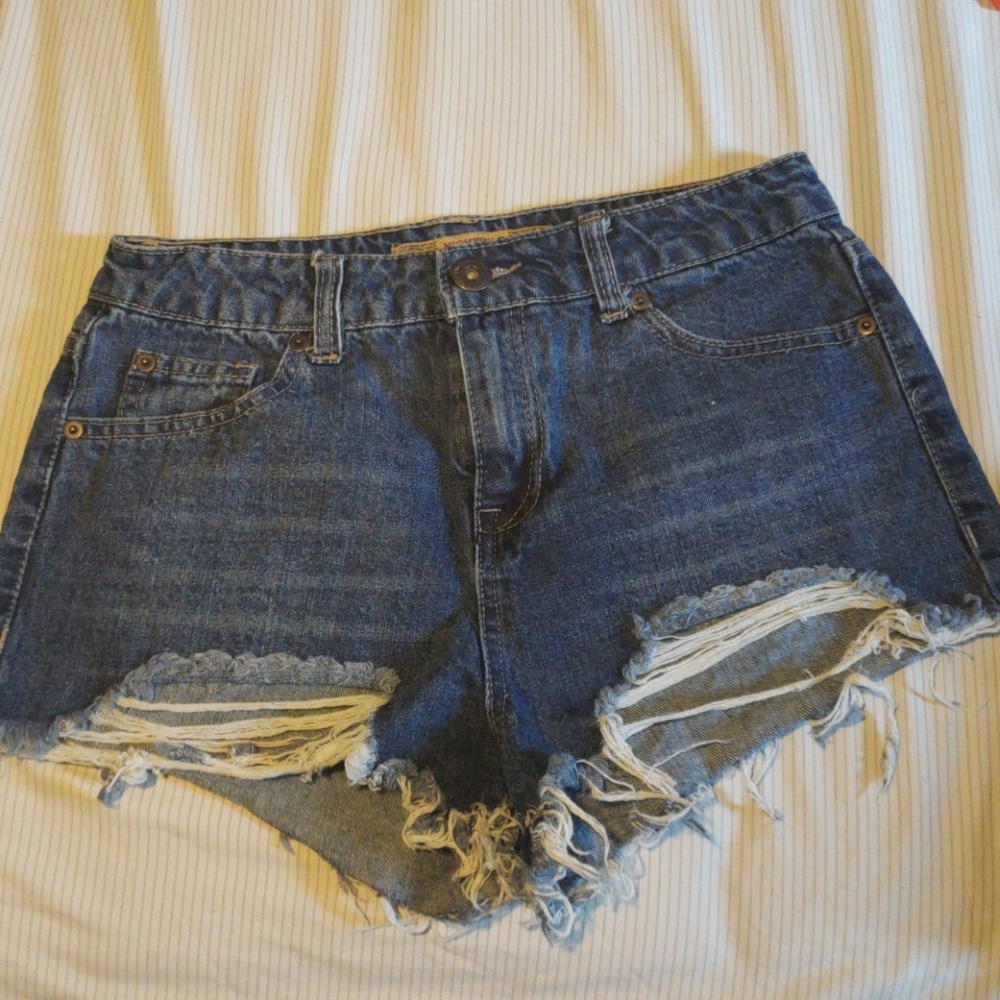 Mid rise frayed blue jean shorts